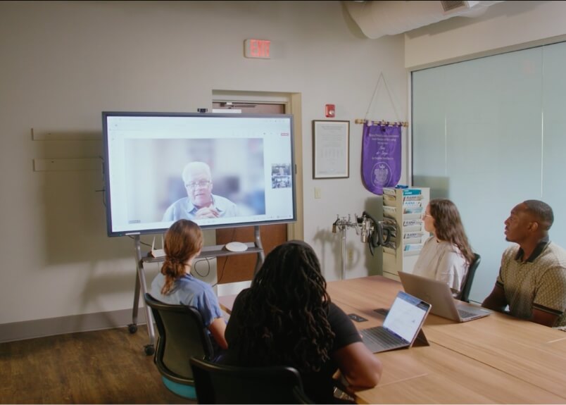 Virtual meeting of students with Dr. Hornsby in a conference room