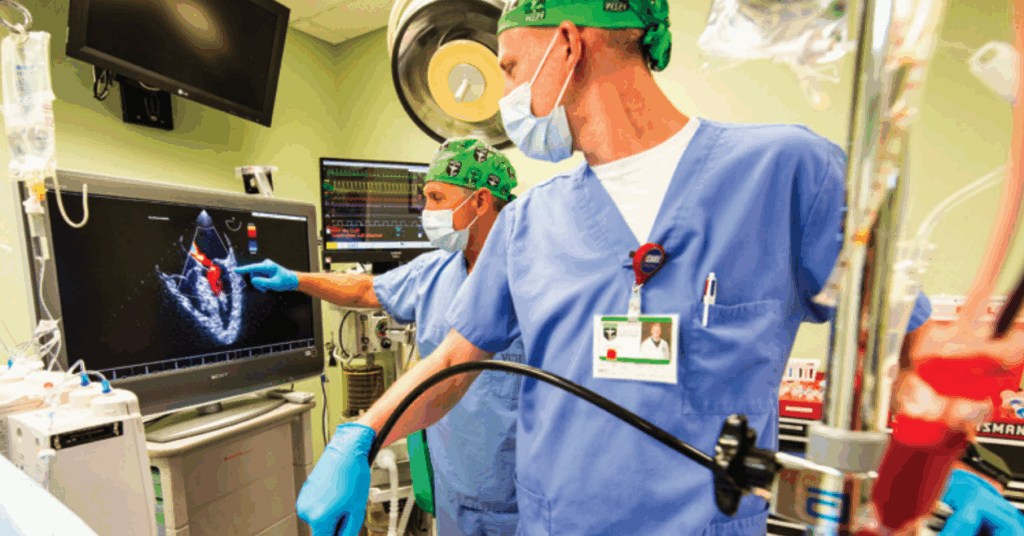 CRNA student and professor looking at ultrasound machine