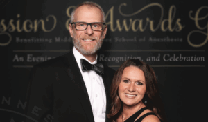Rusty Gentry and wife smiling at awards ceremony
