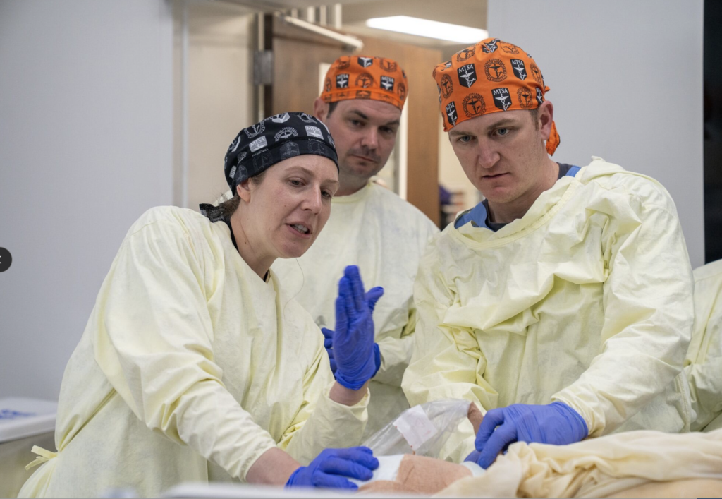 instructor helping students understand different ultrasound techniques
